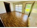 Bright living room featuring new laminate floors and three points of entry at 704 W Alder St., Andrews, SC 29510
