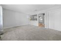 Bright living room featuring neutral carpet and paint, with a passthrough to the kitchen at 755 Burcale Rd. # E-3, Myrtle Beach, SC 29579