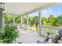Relaxing outdoor porch area with comfortable seating and scenic views of the surrounding neighborhood at 12 Jerry Ct., Pawleys Island, SC 29585