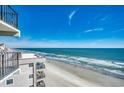 Beautiful beach view from the balcony of condo with a view of the ocean and sandy beach at 1210 N Waccamaw Dr. # 602, Murrells Inlet, SC 29576