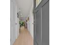 Bright hallway with hardwood floors and view into the living spaces at 132 Machrie Loop # A, Myrtle Beach, SC 29588