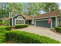 Lovely blue home with a two-car garage and well-manicured landscaping at 1325 Clipper Dr., North Myrtle Beach, SC 29582