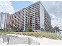 Beachfront condo building view from sandy beach with dunes and ocean view at 1501 S Ocean Blvd. # 239, Myrtle Beach, SC 29577