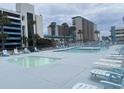 Large swimming pool area with lounge chairs and a smaller kiddie pool at 1600 S Ocean Blvd. S # 150, Myrtle Beach, SC 29577