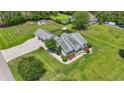 Aerial view showcasing a well-maintained home, lush lawn, and convenient circular driveway at 1609 Bridgebrook Ln., Conway, SC 29527