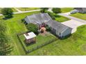 Aerial view of backyard featuring manicured lawn, fenced garden area, and ample space at 1609 Bridgebrook Ln., Conway, SC 29527