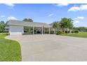 Expansive driveway leading to a garage and covered outdoor living area with ample parking space at 1609 Bridgebrook Ln., Conway, SC 29527