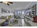 Comfortable living room with beach decor and access to a balcony with views at 2001 S Ocean Blvd. # 1504, Myrtle Beach, SC 29577