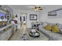 Nicely decorated living room with tile floors, dining table and couch at Bluewater Resort #1504 at 2001 S Ocean Blvd. # 1504, Myrtle Beach, SC 29577