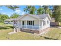 Charming single story home with a inviting front porch, black shutters, and brick foundation at 204 Elm St., Johnsonville, SC 29555