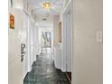 Hallway view featuring tile floors leading to living area with ocean view at 2500 N Ocean Blvd. # 601, Myrtle Beach, SC 29577