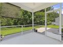 Relaxing screened porch with views of a private backyard and lush greenery, perfect for outdoor enjoyment at 278 Carolina Crossing Blvd., Little River, SC 29566