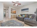 Open-concept living room with a view to the kitchen, complete with comfortable seating and stylish decor at 310 Kiskadee Loop # D, Conway, SC 29526