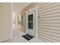 Inviting entryway featuring a 'Welcome' mat, stylish door with decorative trim, and a well-maintained exterior at 3104 Sweetwater Blvd. # 3104, Murrells Inlet, SC 29576