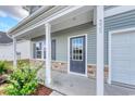 Covered front porch shows the entrance door and the house number at 335 Garden Grove St, Conway, SC 29526