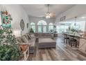 Spacious living room with vaulted ceilings, a ceiling fan, and wood flooring, perfect for entertaining guests at 359 Harbour Reef Dr., Myrtle Beach, SC 29588