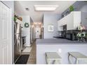 Functional kitchen featuring a breakfast bar, stainless steel appliances, and access to the hallway at 3939 Gladiola Ct. # 202, Myrtle Beach, SC 29588