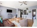 Inviting living room showcasing hardwood floors, an entertainment area, and a view of the kitchen at 3939 Gladiola Ct. # 202, Myrtle Beach, SC 29588