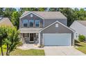 Charming two-story home featuring a two-car garage, and a beautifully landscaped front yard at 4501 Farm Lake Dr., Myrtle Beach, SC 29579