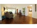 Spacious living room with hardwood floors, a ceiling fan, and lots of natural light at 513 Westham Dr., Murrells Inlet, SC 29576