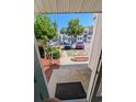 Welcoming entryway view showcasing manicured landscaping, ample parking, and attractive townhome facades at 600 Deer Creek Rd. # D, Surfside Beach, SC 29575