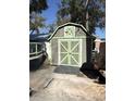 A shed with green trim, providing extra storage space for tools or equipment at 6001-Z67 S Kings Hwy., Myrtle Beach, SC 29575