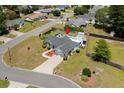 An aerial view showcases the home's layout, pool area, landscaping, and neighborhood location at 601 Jousting Ct., Conway, SC 29526