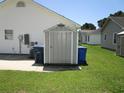 Backyard storage shed and trashcans near house at 811 Rogers Dr., Myrtle Beach, SC 29577