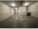 Spacious unfinished two car garage with concrete floor and drywall at 9409 Long Meadow Way, Longs, SC 29568