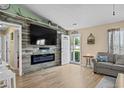 Comfortable living room showcases a cozy fireplace and easy access to front yard at 990 Chateau Dr., Conway, SC 29526