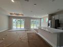 Bright, open-concept kitchen with large sliding glass doors to backyard at 1000 Lady Bird Way, North Myrtle Beach, SC 29582