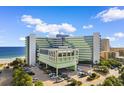 Attractive exterior view of a beachfront resort offering convenient parking and easy access to the sandy shores at 1105 S Ocean Blvd. # 110, Myrtle Beach, SC 29577