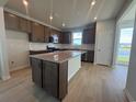 Modern kitchen featuring stainless steel appliances, stylish cabinets, and an island at 1232 Lady Bird Way, North Myrtle Beach, SC 29582