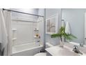 Bright bathroom with a shower-tub combination and modern fixtures, perfect for relaxation at 143 Warner Crossing Way, Loris, SC 29569