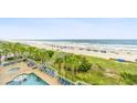 Resort-style pool with lush tropical landscaping offers the perfect oasis for relaxation and beach access at 1625 S Ocean Blvd. # 309, North Myrtle Beach, SC 29582