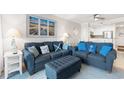 Living room with coastal decor, comfortable seating, and view into the kitchen at 208 Ocean Blvd. N # 226, North Myrtle Beach, SC 29582