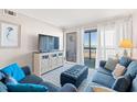 Cozy living room with ample seating and ocean view from balcony at 208 Ocean Blvd. N # 226, North Myrtle Beach, SC 29582