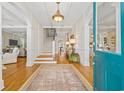 Grand foyer featuring hardwood floors, staircase, and an open layout, creating an inviting entrance at 21 Whitehall Ave., Georgetown, SC 29440