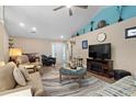 Inviting living room with neutral tones, a large ceiling fan, and stylish decor at 4 Clemson Rd., Conway, SC 29526