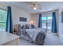 Cozy bedroom with two windows, plush bedding, and soothing blue accents for a relaxing atmosphere at 4486 Little River Inn Ln. # 2107, Little River, SC 29566