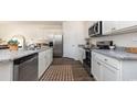 Bright kitchen featuring white cabinets, stainless steel appliances, granite countertops, and modern fixtures at 5141 Yellowstone Dr., Conway, SC 29526