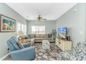Cozy living room with plush seating, ceiling fan, and natural light for a relaxing atmosphere at 6001-1168 S Kings Hwy., Myrtle Beach, SC 29575