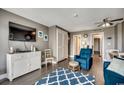 Stylish living room with a wall-mounted TV and modern decor, flowing into the dining area at 7500 N Ocean Blvd. # 6061, Myrtle Beach, SC 29572