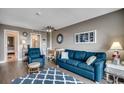 Nicely decorated living room featuring grey walls, blue accents, and an adjacent dining area at 7500 N Ocean Blvd. # 6061, Myrtle Beach, SC 29572