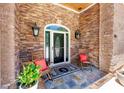 Inviting front entrance features a stone facade, decorative door with sidelights, and seating area at 784 Caines Landing Rd., Conway, SC 29526