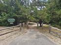 Inviting Briarcliffe Acres Association entrance with a well-maintained pathway surrounded by lush greenery at 814 Night Heron Ln., Myrtle Beach, SC 29572