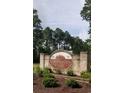 A welcoming sign with manicured landscaping marks the entrance to Forestbrook Estates at 8211 Forest Edge Dr., Myrtle Beach, SC 29579