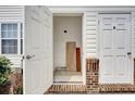 Showing the entryway with neutral walls, a tiled floor, and adjacent utility closet for storage at 8855 Radcliff Dr. Nw # 53C, Calabash, NC 28467