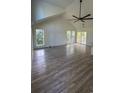 Spacious living room with wood floors, a ceiling fan, and bright, airy windows at Tbd Park St., Georgetown, SC 29440