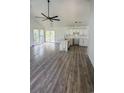 Spacious living room with wood floors, a ceiling fan, and bright, airy windows at Tbd Park St., Georgetown, SC 29440
